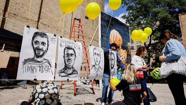 <div class="paragraphs"><p>People attend the launch of the exhibit "Hostage Square Chicago", an event hosted by Israeli-American Council (IAC) featuring artworks by Israeli and American artists dedicated to the memory of the victims of October 7, amid the Israel-Hamas conflict, in Chicago, Illinois, US, August 20, 2024. </p></div>