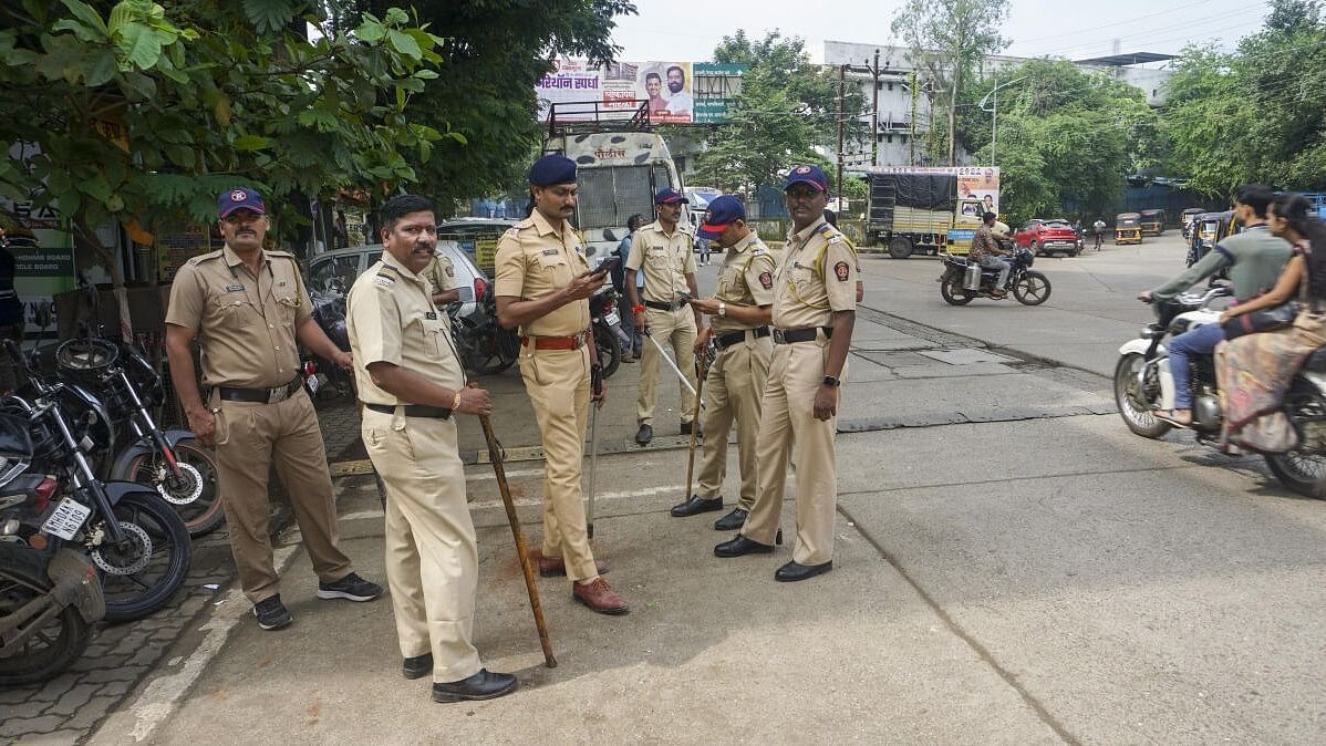 <div class="paragraphs"><p>Police personnel stand guard after two kindergarten girls were allegedly sexually abused at a school at Badlapur, in Thane district, Wednesday, Aug. 21, 2024. The alleged crime by a male attendant created a volatile situation in the town on Tuesday, with protesting parents and locals crippling rail services and clashing with police. </p></div>