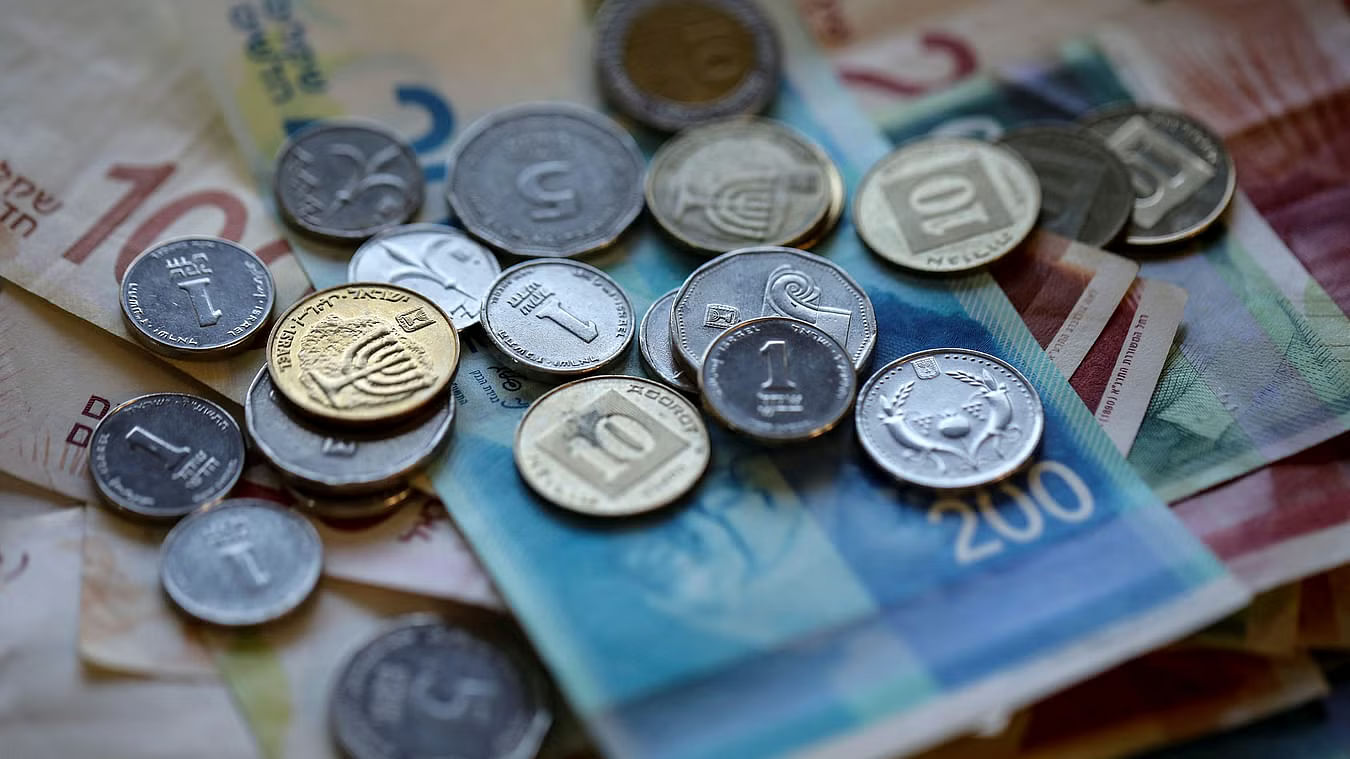 <div class="paragraphs"><p>Israeli Shekel banknotes and coins are seen in this picture illustration.</p></div>