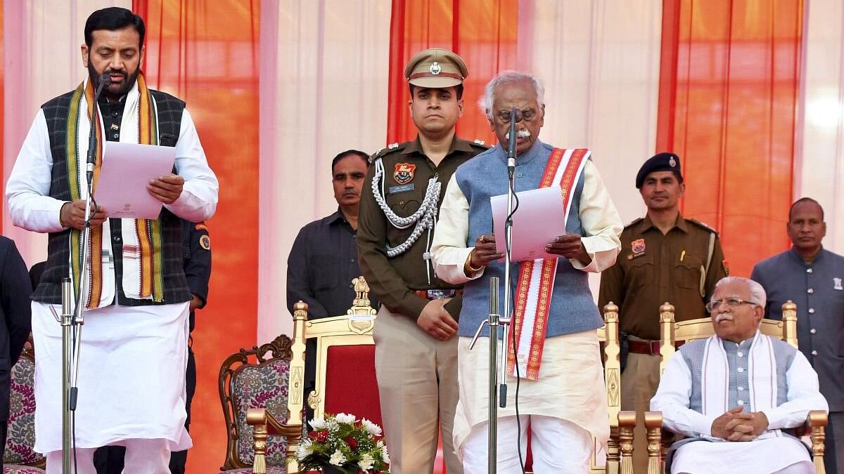 <div class="paragraphs"><p>Haryana Governor Bandaru Dattatreya administers the oath to BJP leader Nayab Singh Saini as chief minister of Haryana, at Raj Bhavan, in Chandigarh, Tuesday, March 12, 2024.</p></div>