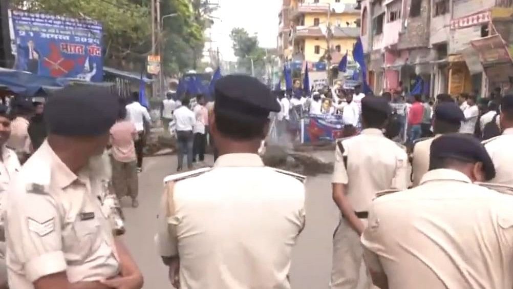 <div class="paragraphs"><p>Police stand guard as members of&nbsp;Reservation Bachao Sangharsh Samiti stage protest in Bihar on August 21, 2024.</p></div>