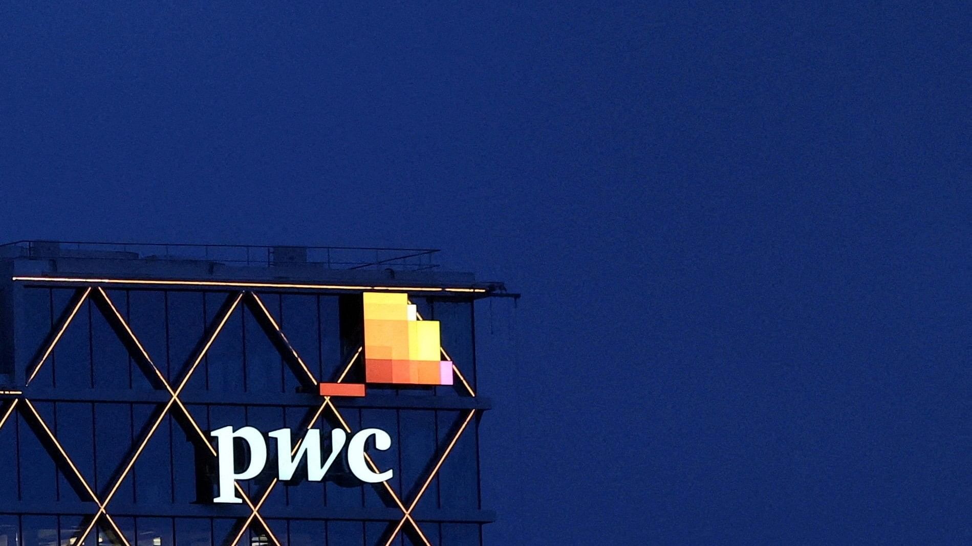 <div class="paragraphs"><p>The logo of PwC is seen on the top of a company office </p></div>