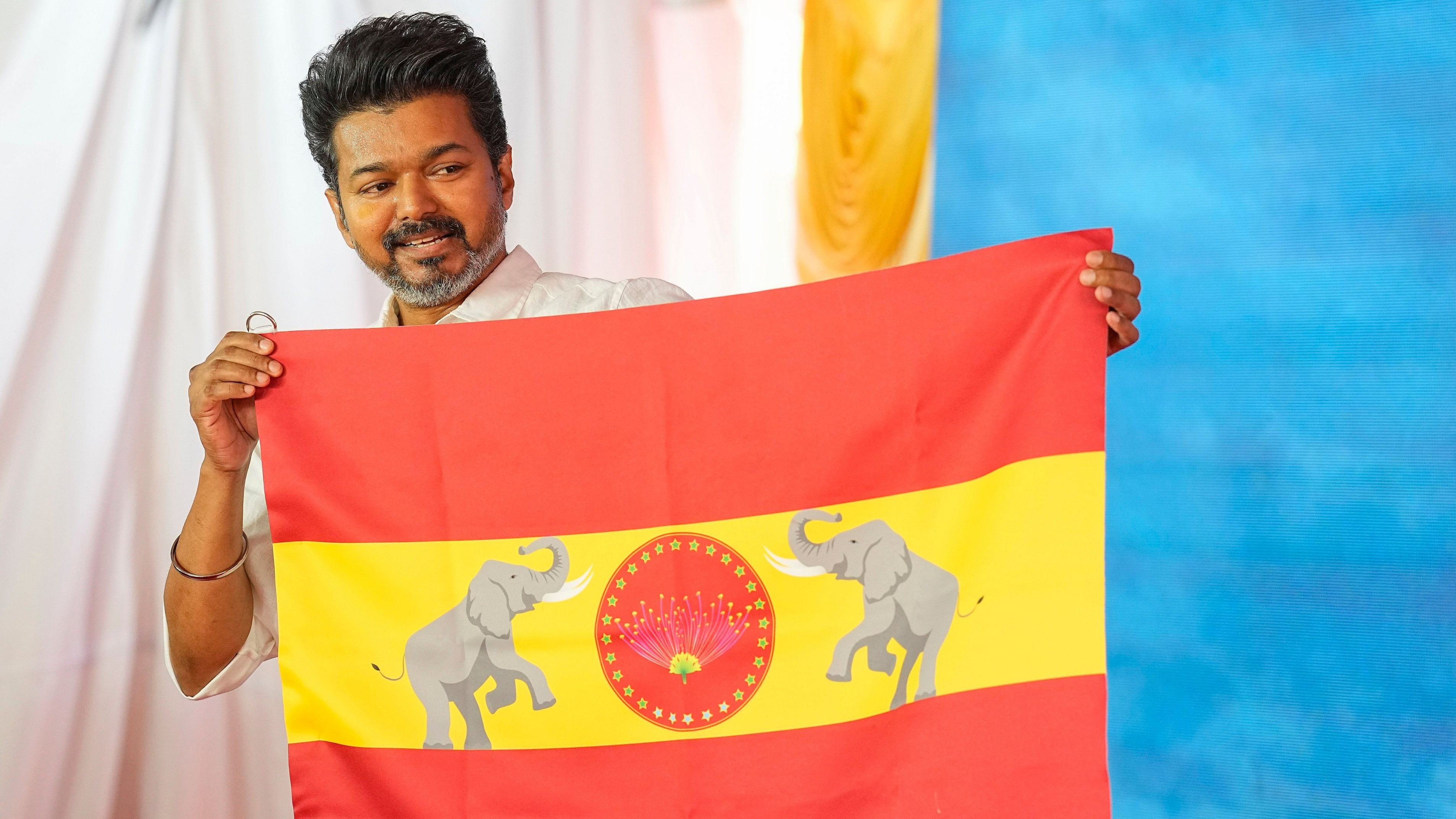 Chennai: Actor-turned-politician and Tamilaga Vettri Kazhagam President Vijay unveils party's flag at party headquarters, on the outskirts of Chennai, Thursday, Aug. 22, 2024. (PTI Photo/R Senthilkumar)(PTI08_22_2024_000028A)