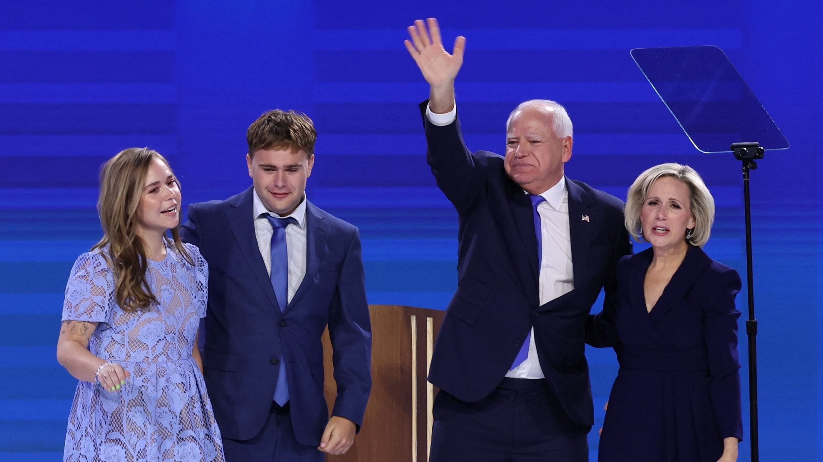 <div class="paragraphs"><p>US Democratic vice-presidential nominee Minnesota Governor Tim Walz (second from right) stands next to his wife Gwen, his son Gus and his daughter Hope on Day 3 of the Democratic National Convention  at the United Center, in Chicago, Illinois, US.</p></div>