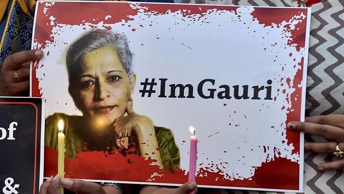 <div class="paragraphs"><p>A poster with the image of Gauri Lankesh.</p></div>