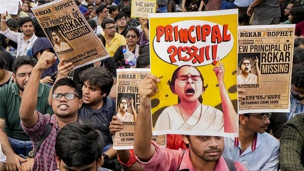 <div class="paragraphs"><p>Doctors shout slogans outside the Swasthya Bhawan during their protest march over the sexual assault and murder of a postgraduate trainee doctor, in Kolkata, Wednesday, Aug. 21, 2024.</p></div>