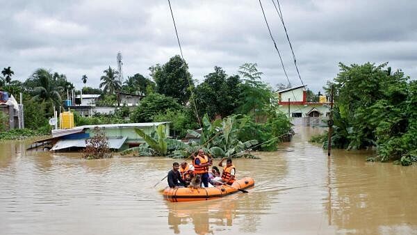 <div class="paragraphs"><p>Rescuers from Tripura Disaster Management Authority evacuate flood-affected people to a safer place following heavy rains at a village on the outskirts of Agartala, India, August 22, 2024.</p></div>