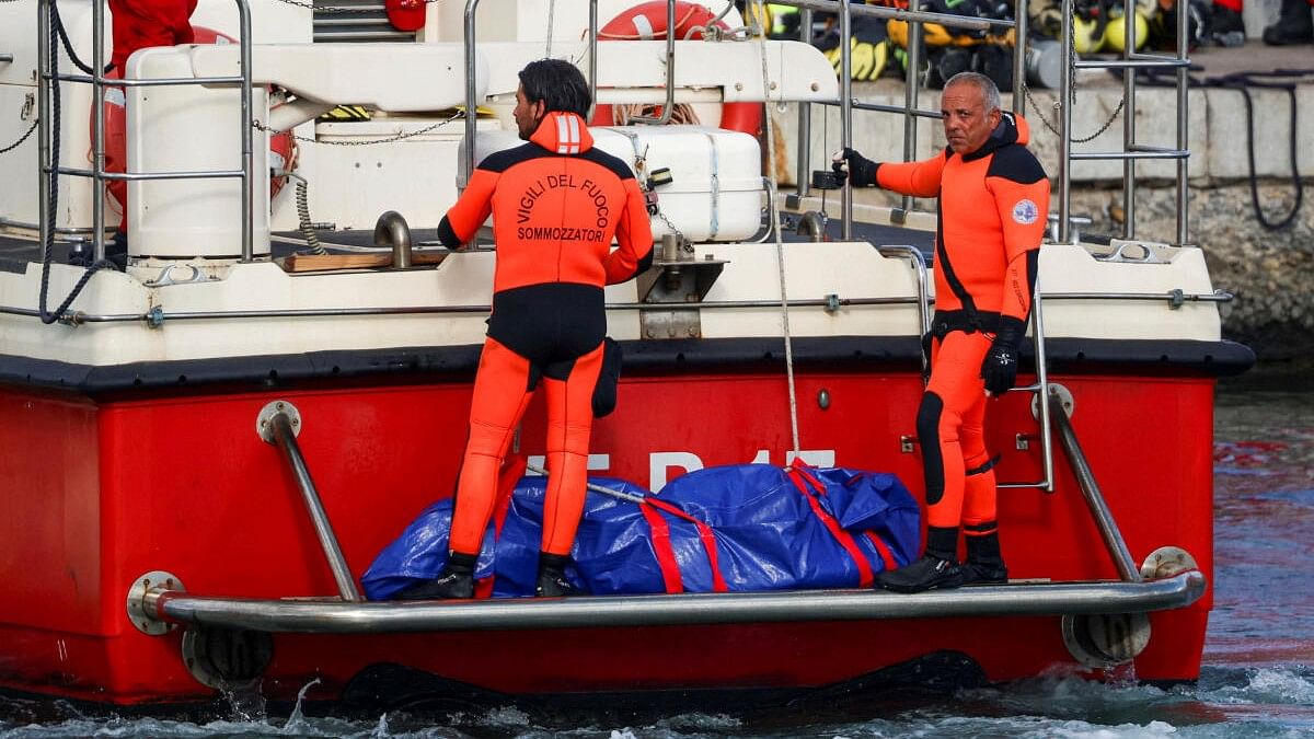 <div class="paragraphs"><p>Rescue personnel transport a body bag after a luxury yacht, which was carrying British entrepreneur Mike Lynch sank off the coast of Porticello.</p></div>