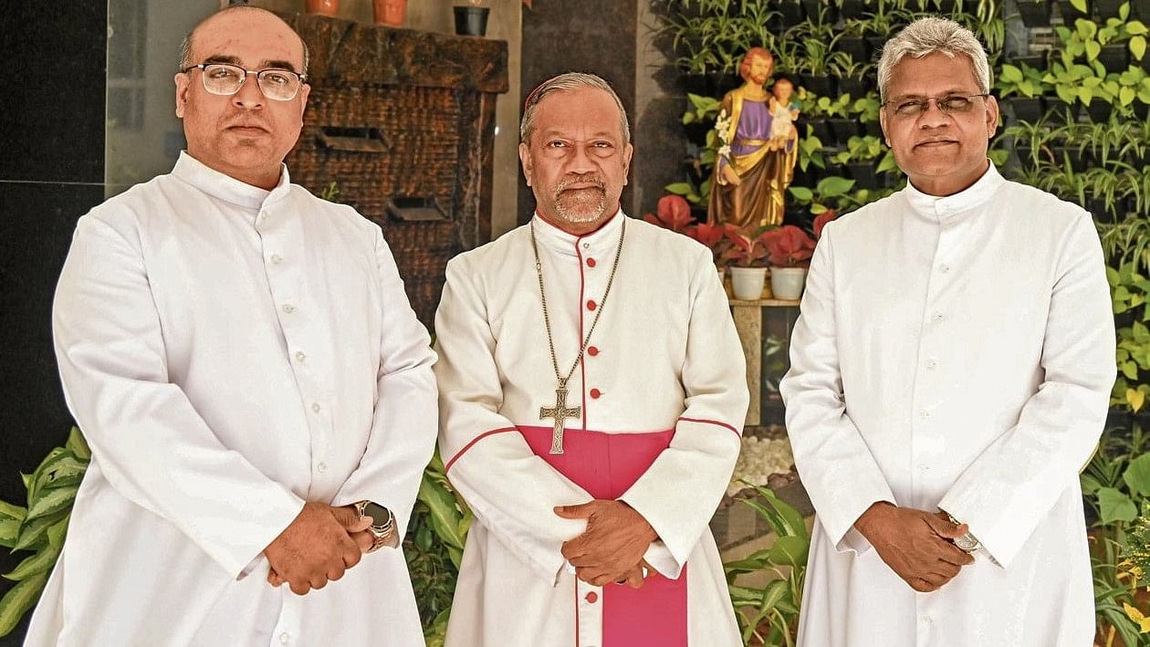 <div class="paragraphs"><p>Dr Peter Machado (centre), Archbishop of Bengaluru with new auxiliary bishops Arokiaraj Satis Kumar (left) and Joseph Susainathan (right) at a press conference in Bengaluru on Thursday. </p></div>