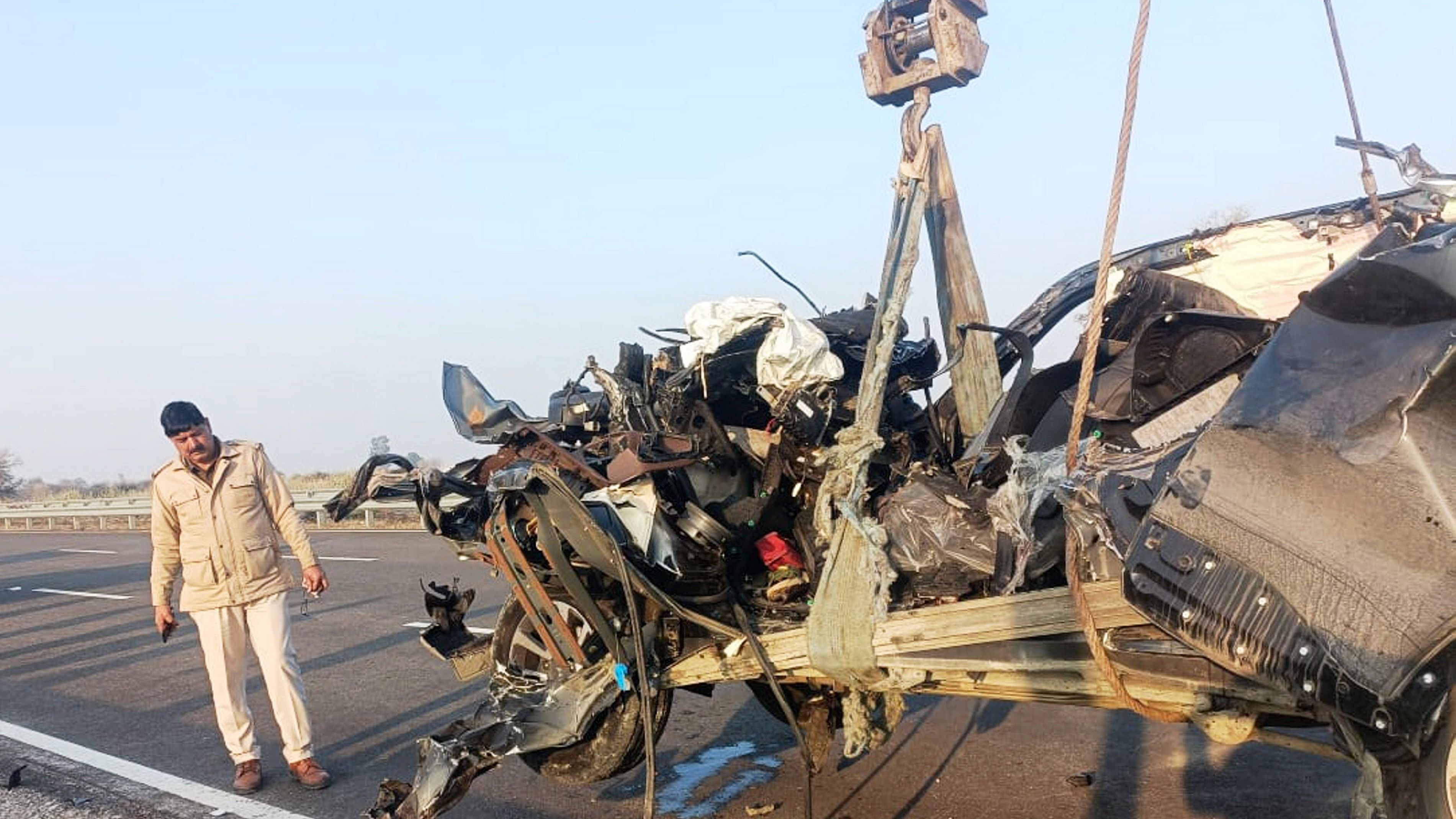 <div class="paragraphs"><p>File Photo: A policeman looks on as mangled remains of a car are taken away from the site of an accident on Bharatmala road.</p></div>