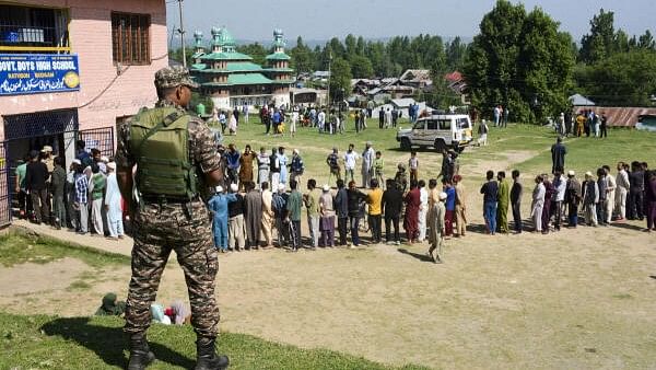 <div class="paragraphs"><p>Voters wait to cast their votes during this year's&nbsp; Lok Sabha elections in Budgam district of central Kashmir.</p></div>