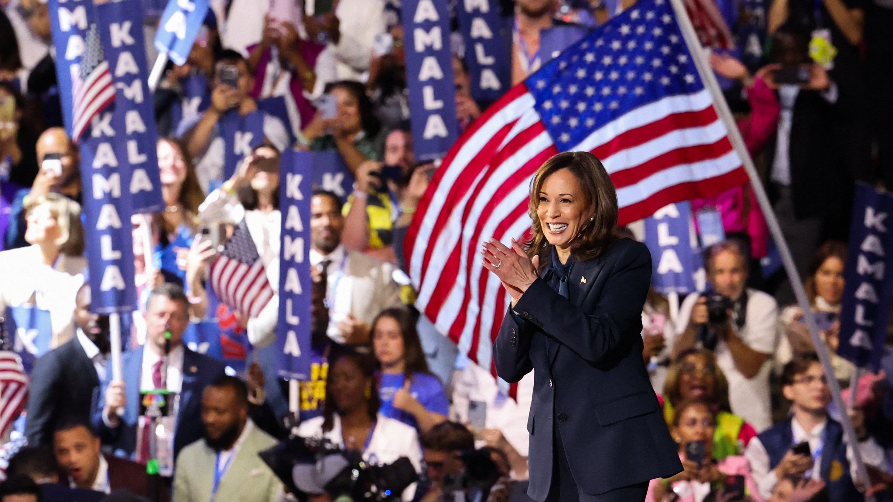 <div class="paragraphs"><p>Democratic presidential nominee and US Vice President Kamala Harris applauds from the stage on Day 4 of the Democratic National Convention  at the United Center in Chicago.&nbsp;</p></div>