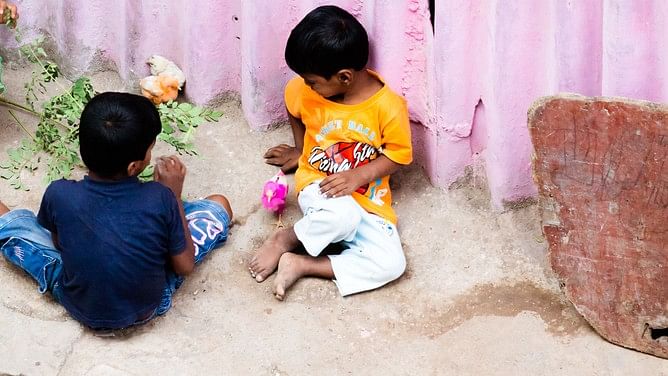 <div class="paragraphs"><p>Representative image of children sitting outside a shelter home.</p></div>