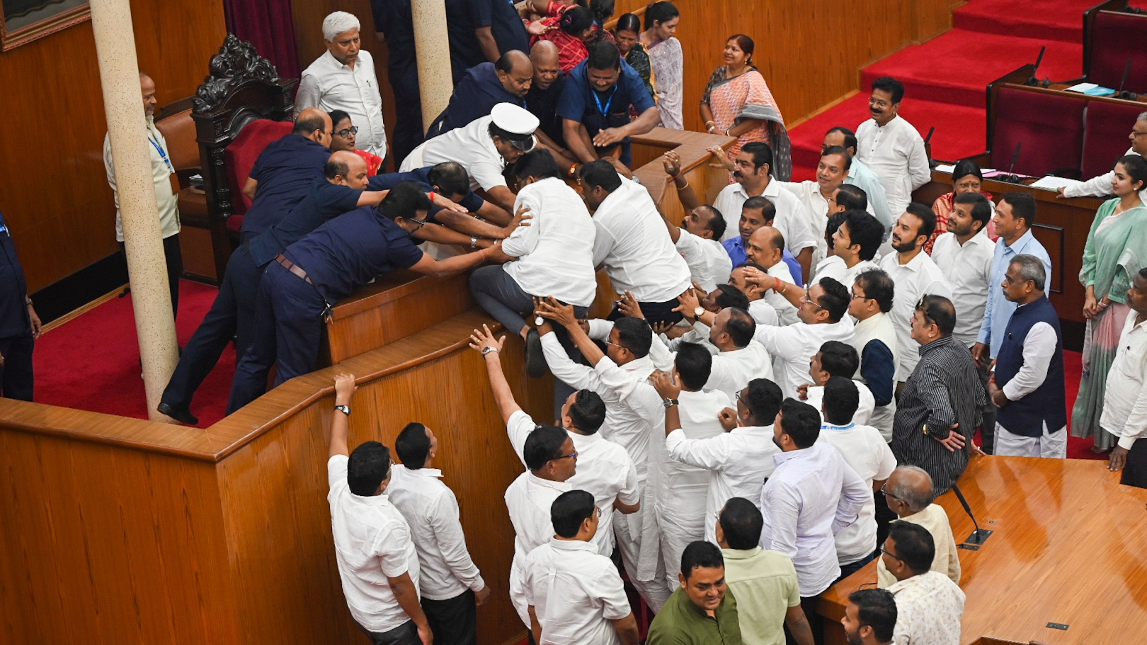 <div class="paragraphs"><p>BJD and Congress MLAs stage a protest demanding resignation of Excise Minister over hooch tragedy during Budget session of the Assembly, in Bhubaneswar, Friday, Aug. 23, 2024. </p></div>