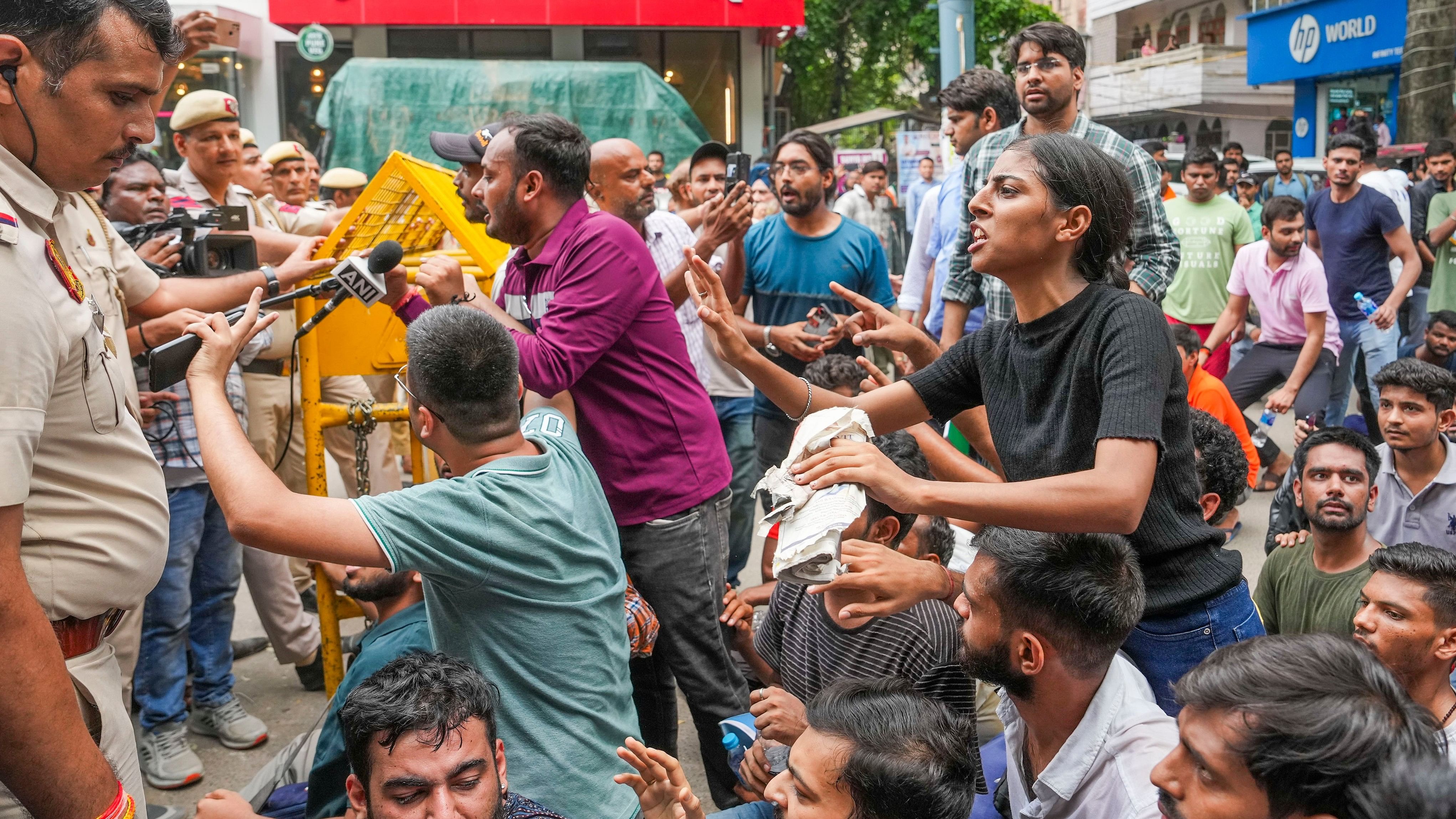 <div class="paragraphs"><p> Students speak to the police personnel during their protest over the deaths of three civil services aspirants due to drowning at a coaching centre in Old Rajinder Nagar area, in New Delhi.</p></div>