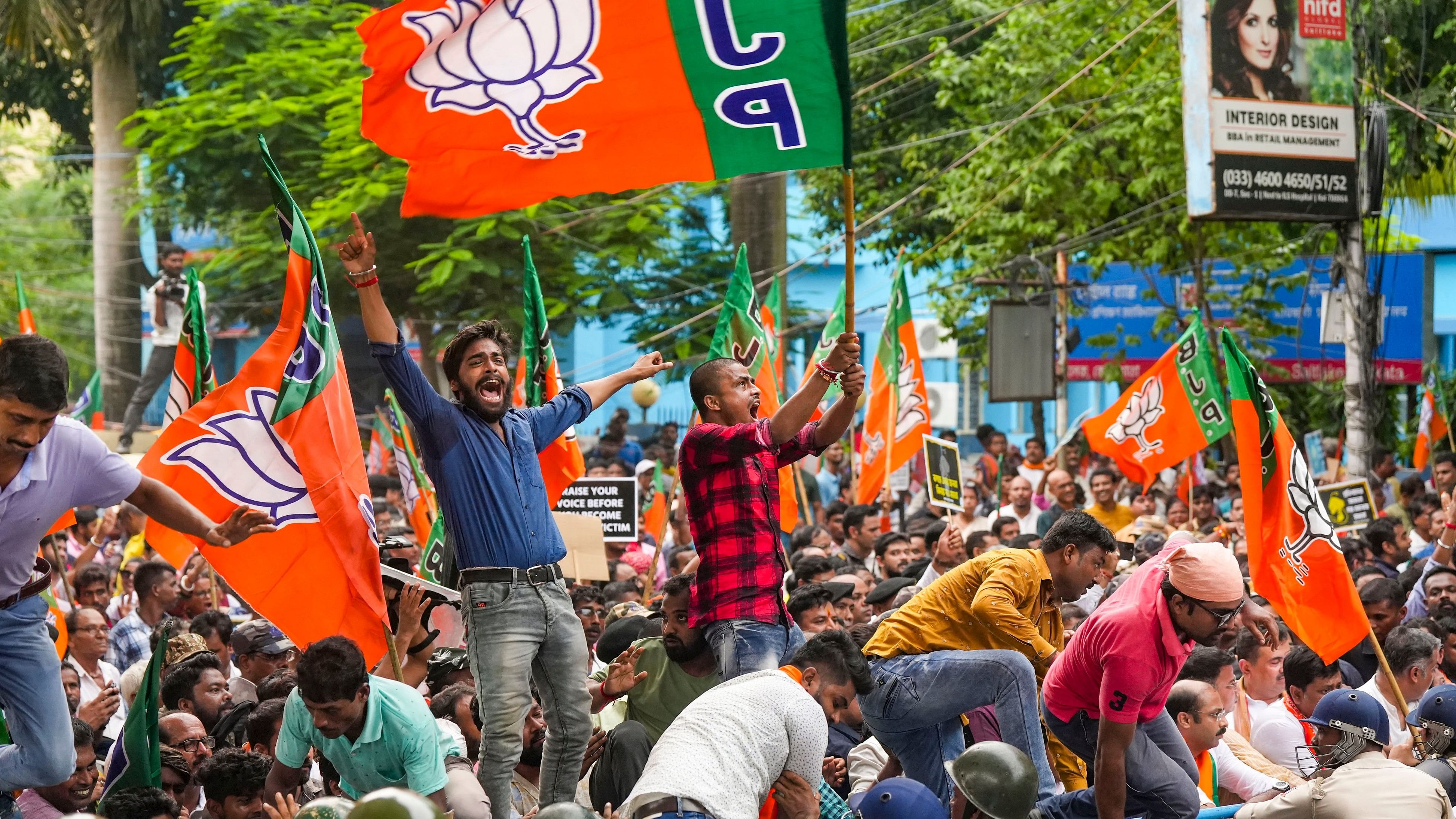 <div class="paragraphs"><p>BJP activists raise slogans during a protest march against alleged rape and murder of a trainee woman doctor at the RG Kar Medical College and Hospital, in Kolkata.&nbsp;</p></div>