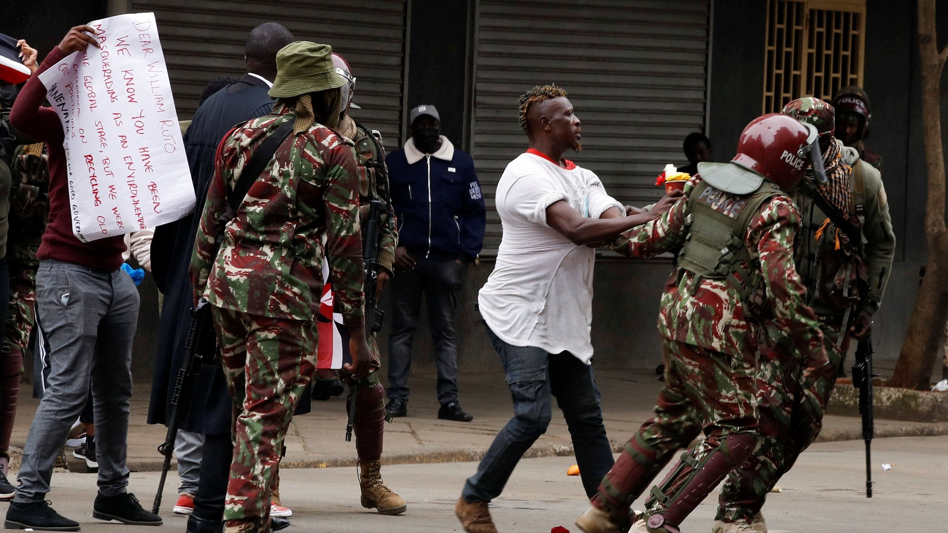 <div class="paragraphs"><p>Riot police officers detain a pro-reform protester during an anti-government demonstration over what organisers say are tax hikes, bad governance, constitutional violations, extra-judicial killings and cost of living, in Nairobi, Kenya.</p></div>