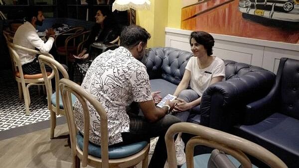 <div class="paragraphs"><p>Uzma (R) chats with another attendee during a matchmaking event organised by Muzz matrimony app at a cafe in Lahore, Pakistan.</p></div>