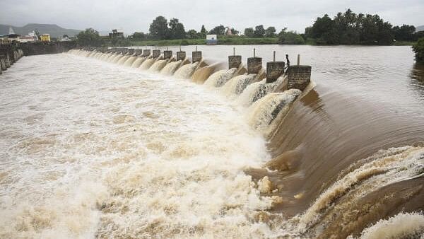 <div class="paragraphs"><p>Water of the Krishna River overflows from Khodshi Dam after rains at Karad, in Satara district, Saturday, July 27, 2024.</p></div>