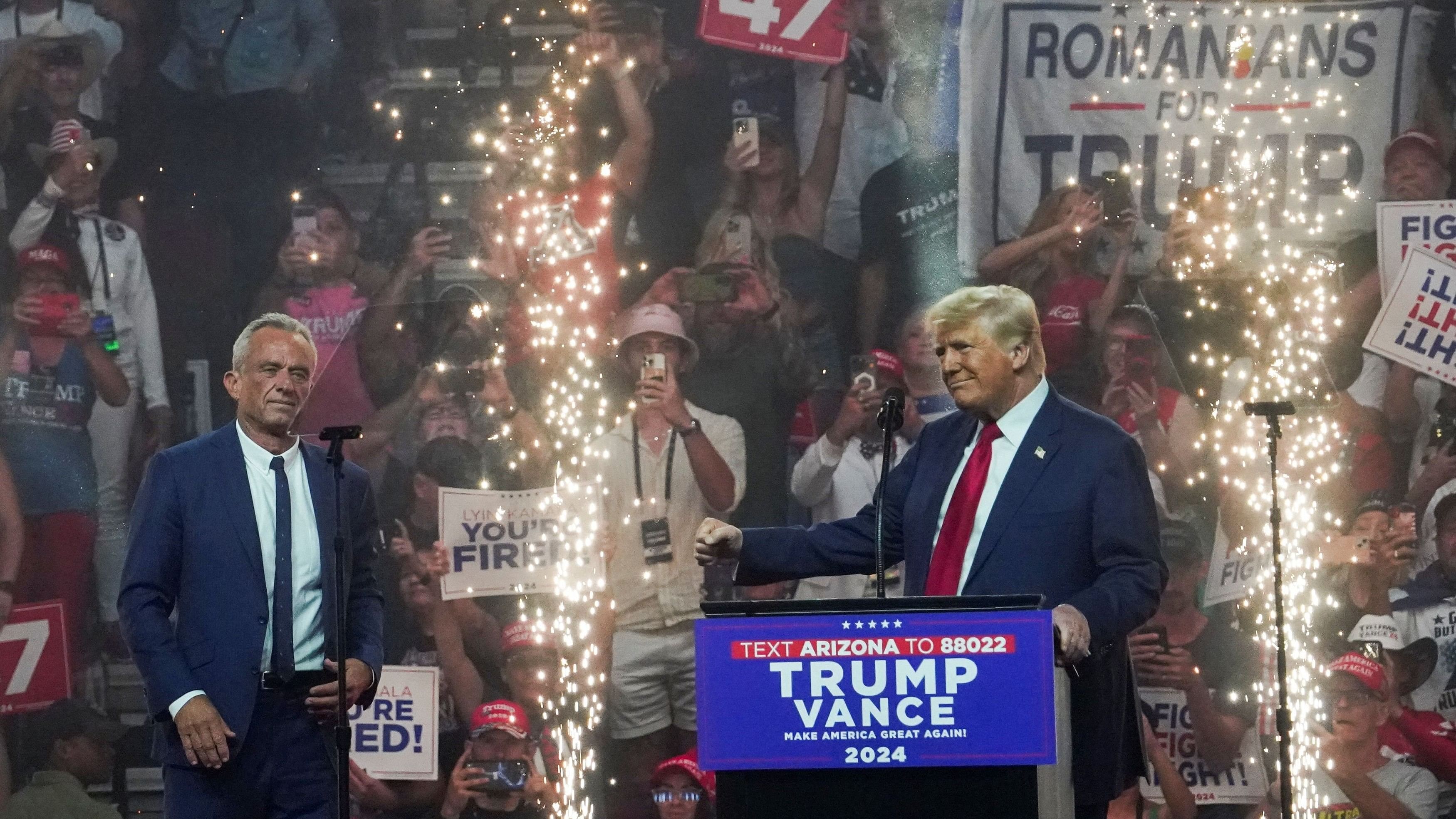 <div class="paragraphs"><p>Republican presidential nominee and former U.S. President Donald Trump speaks during a rally as former independent presidential candidate Robert F. Kennedy Jr. looks on in Glendale, Arizona.</p></div>