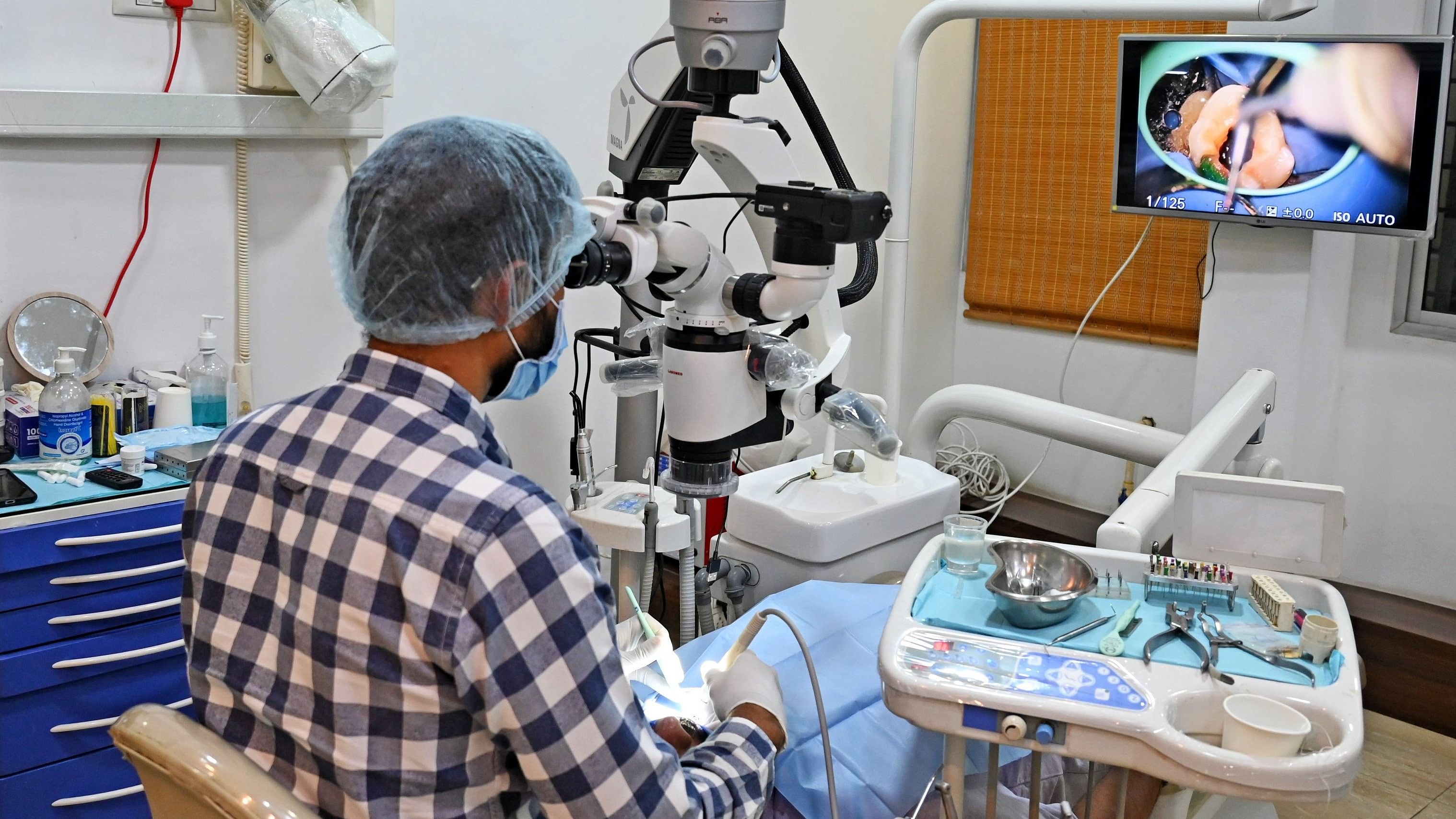 <div class="paragraphs"><p>A doctor works at his advanced dental care clinic;&nbsp;Street ‘dentists’ treat people in Bengaluru. </p></div>