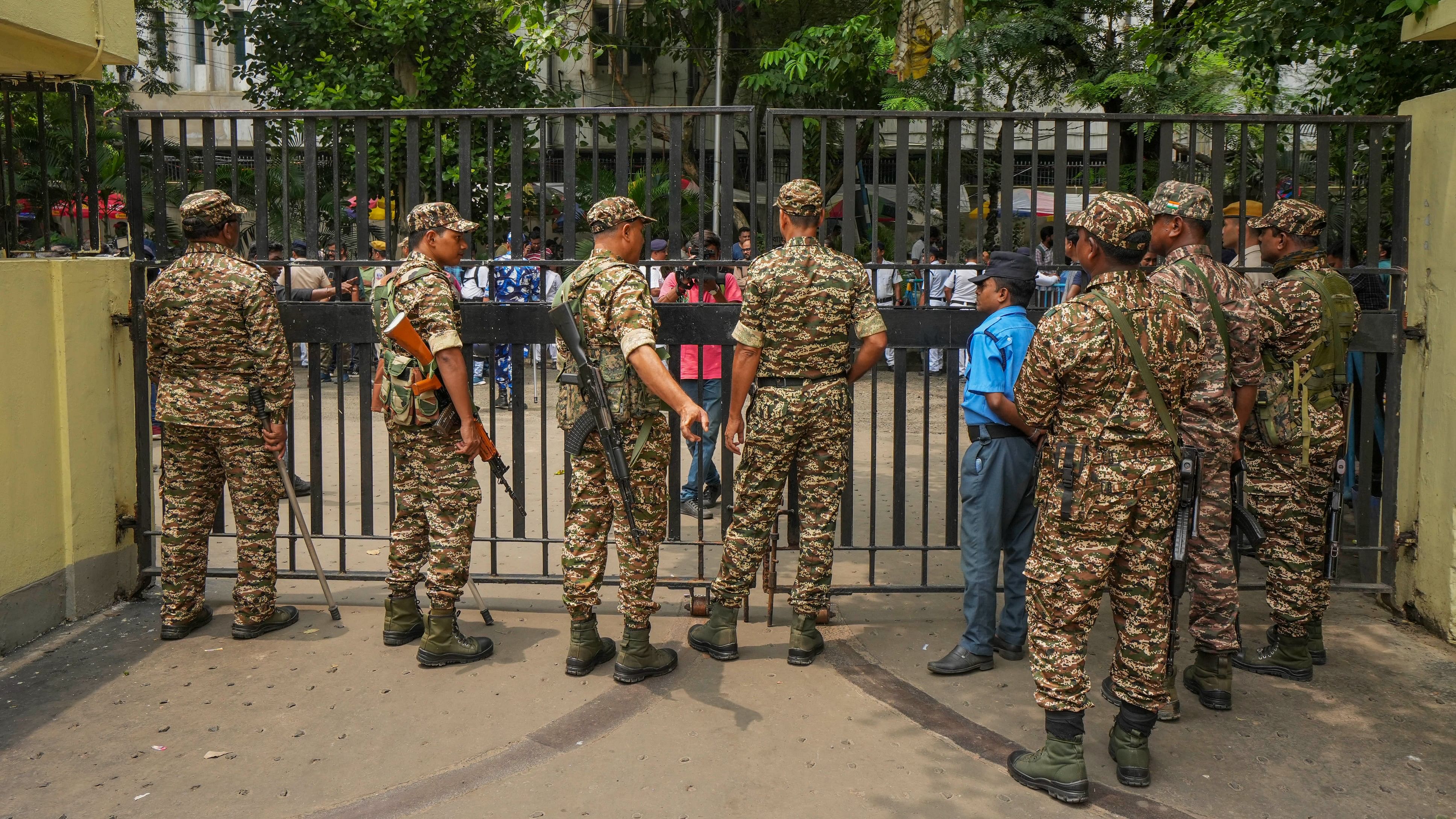 <div class="paragraphs"><p>Seurity personnel stand guard at Central Government Offices (CGO) complex, housing the CBI office, in Kolkata, Wednesday, Aug. 21, 2024.</p></div>