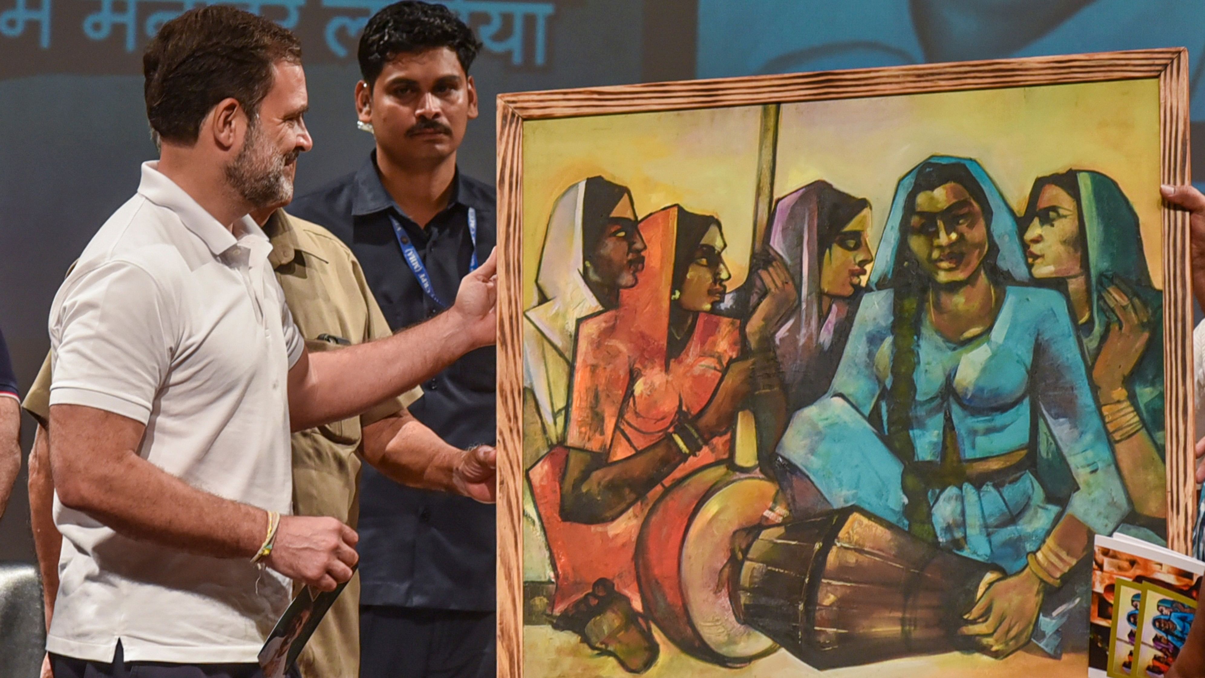 <div class="paragraphs"><p>Rahul Gandhi being presented a painting during the 'Samvidhan Samman Sammelan' in Prayagraj, Saturday on Aug. 24</p></div>