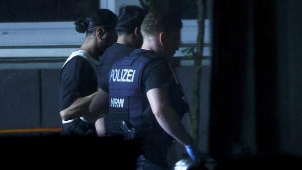 <div class="paragraphs"><p>Police officers detain a person, following an incident in which several individuals were killed after a man randomly stabbed passers-by with a knife at a city festival, in Solingen, Germany.&nbsp;</p></div>