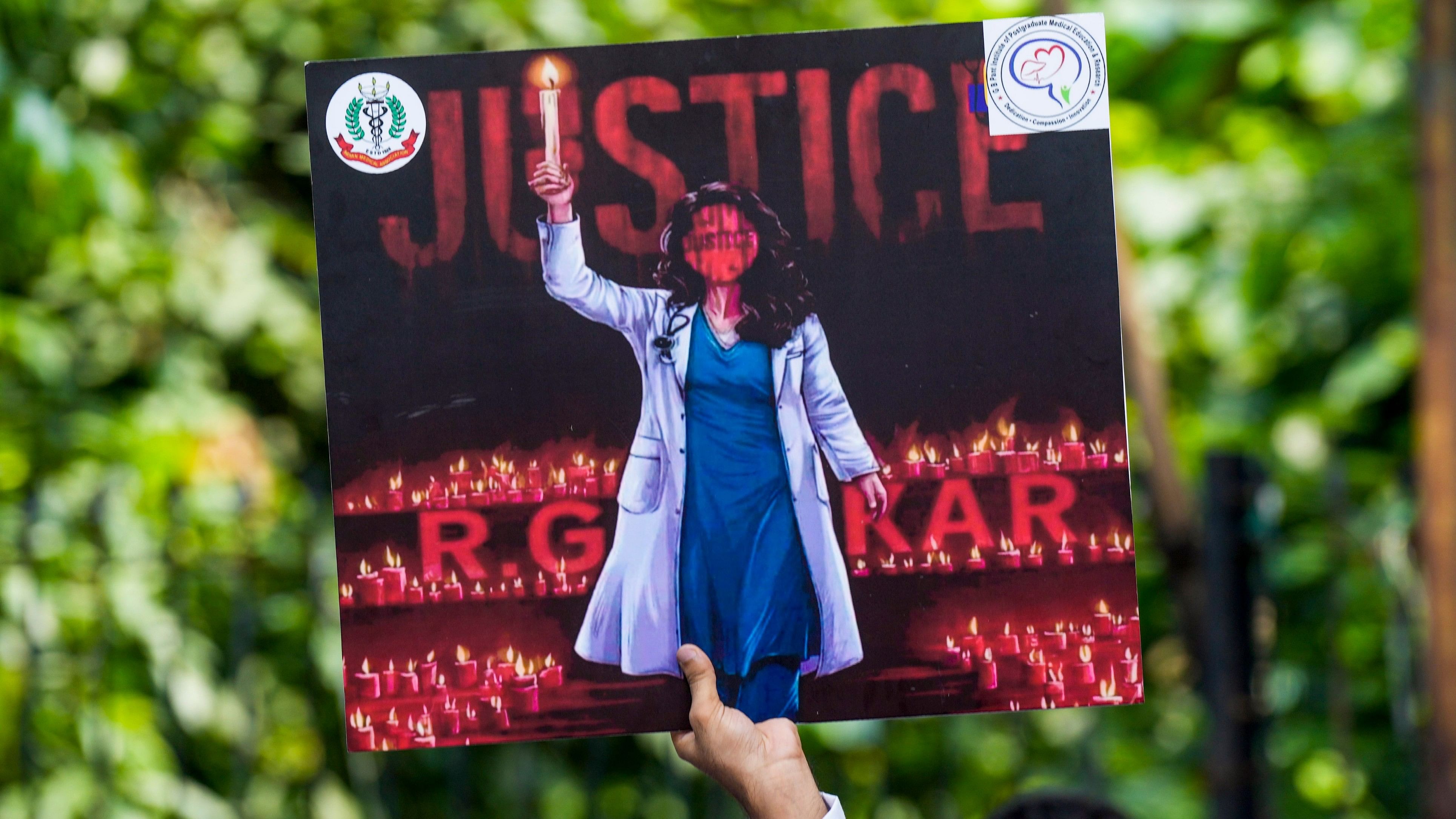 <div class="paragraphs"><p>New Delhi: A placard held by a doctor during a protest over the alleged sexual assault and murder of a postgraduate trainee doctor, at Jantar Mantar, in New Delhi, Wednesday, Aug. 21, 2024.</p></div>