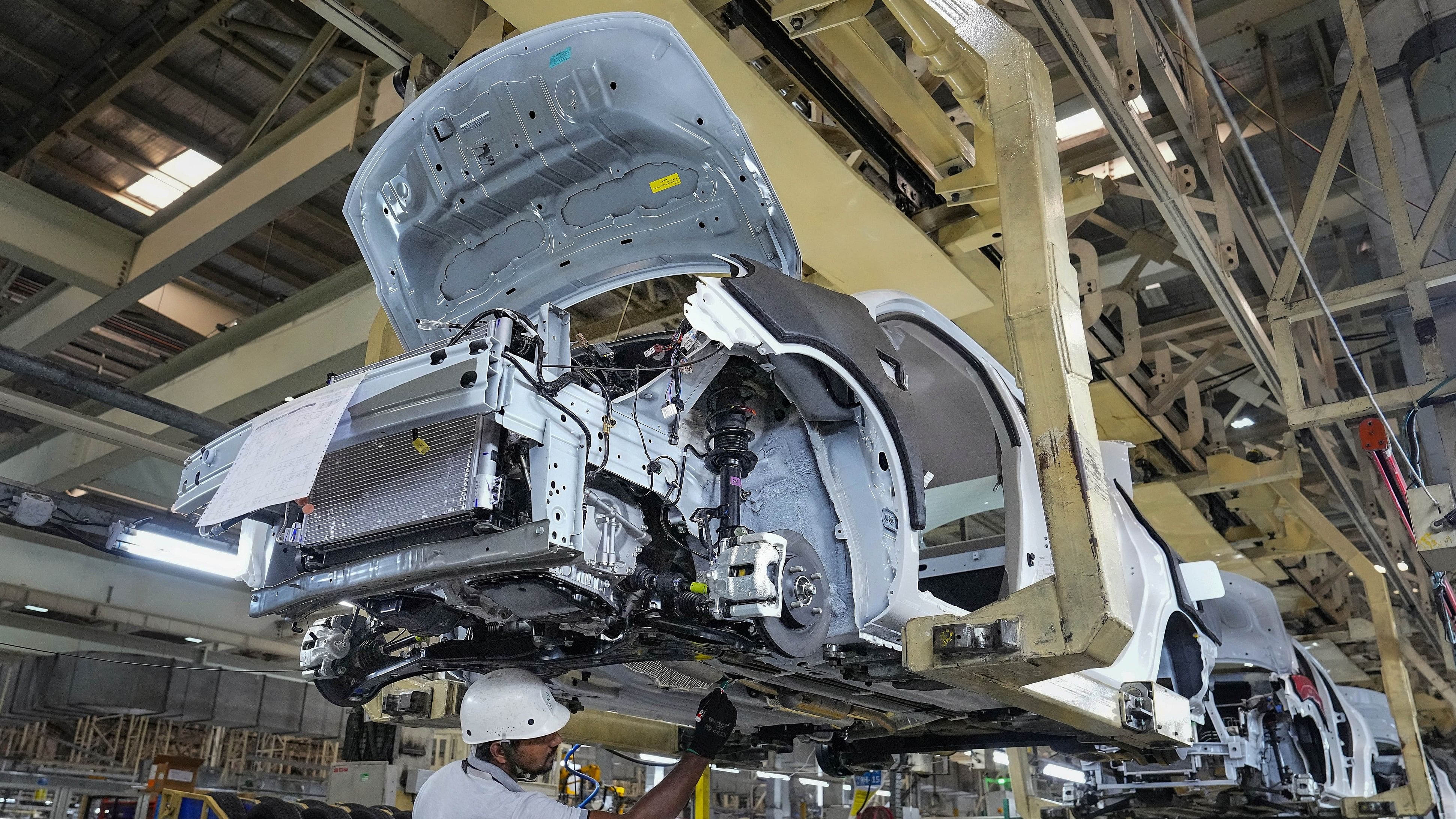 <div class="paragraphs"><p>Employees work in an assembly line at the joint manufacturing facility of Renault-Nissan Automotive India Pvt Ltd, near Chennai.</p></div>