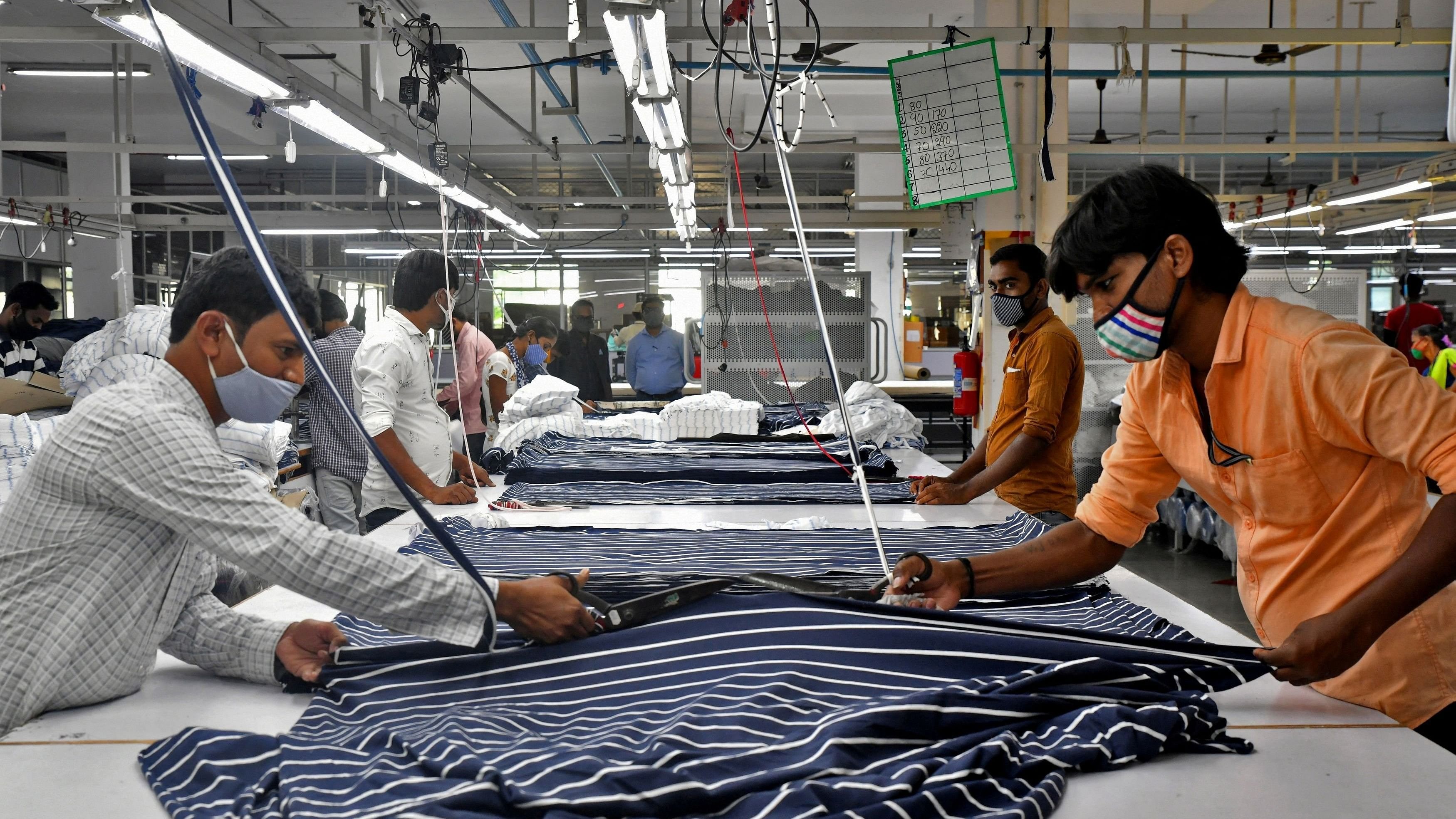 <div class="paragraphs"><p> Garment workers cut fabric to make shirts at a textile factory of Texport Industries in Hindupur town in Andhra Pradesh.</p></div>