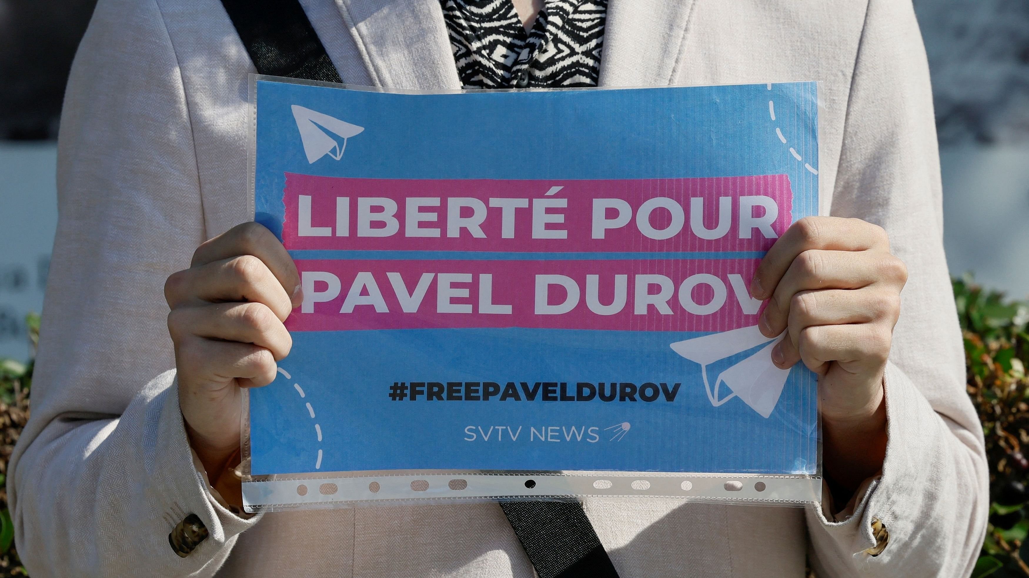 <div class="paragraphs"><p>A participant of a one-person picket demonstrates a placard to bring attention to the arrest of Pavel Durov, founder and CEO of the Telegram messaging app, near the French embassy in Moscow, Russia.</p></div>