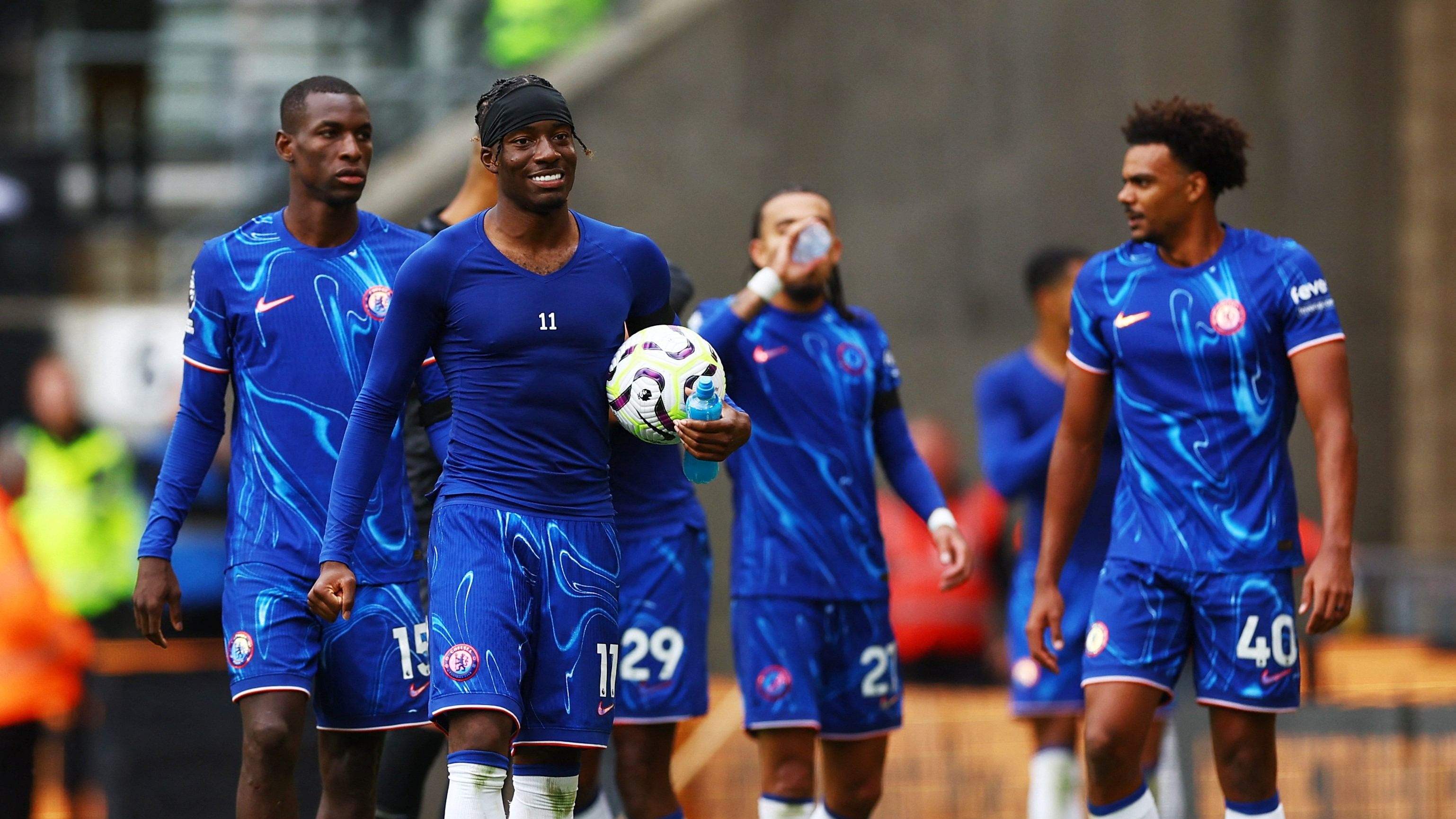 <div class="paragraphs"><p> Chelsea's Noni Madueke holds the match ball after scoring a hat-trick.</p></div>