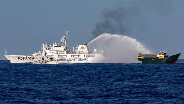 <div class="paragraphs"><p>Chinese Coast Guard vessels fire water cannons towards a Philippine resupply vessel Unaizah  on its way to a resupply mission at Second Thomas Shoal in the South China Sea earlier this year.</p></div>