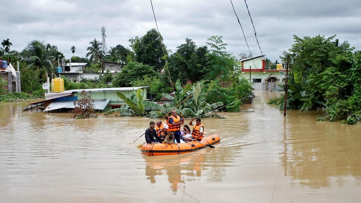 <div class="paragraphs"><p>Rescuers from Tripura Disaster Management Authority evacuate flood-affected people to a safer place following heavy rains at a village on the outskirts of Agartala.</p></div>