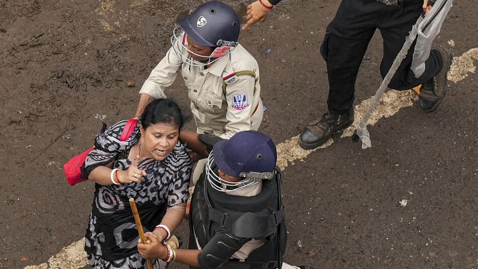 <div class="paragraphs"><p>Police personnel detain a woman during a protest march in Kolkata. (Representative image)</p></div>