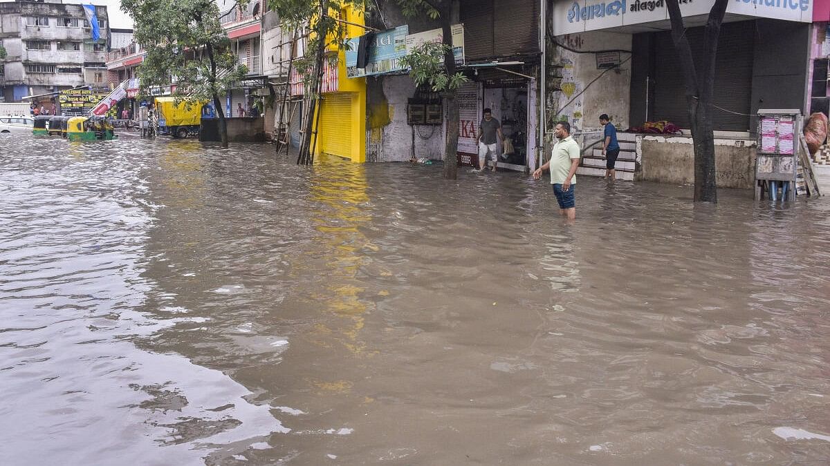 <div class="paragraphs"><p>A waterlogged road at Ved Darwaja after heavy rainfall, in Surat, Tuesday, Aug 27, 2024.</p></div>