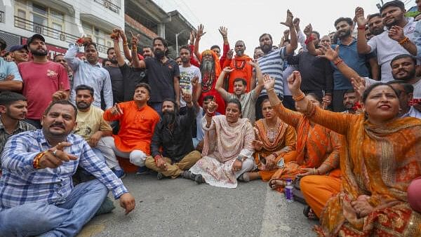 <div class="paragraphs"><p>BJP workers block Mata Vaishno Devi road as they protest over the denial of ticket to party leader Rohit Dubey for upcoming Assembly polls, at Katra in Reasi district.</p></div>