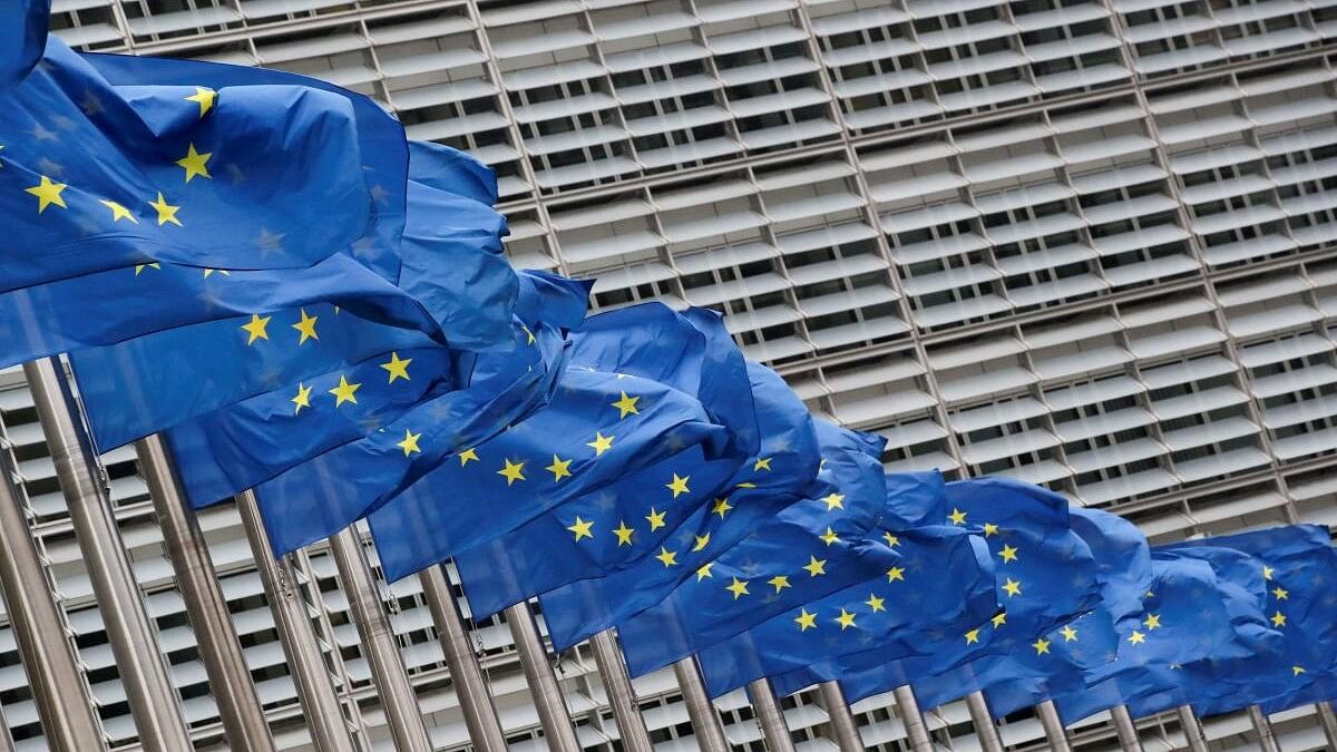 <div class="paragraphs"><p>European Union flags flutter outside the EU Commission headquarters in Brussels.</p></div>