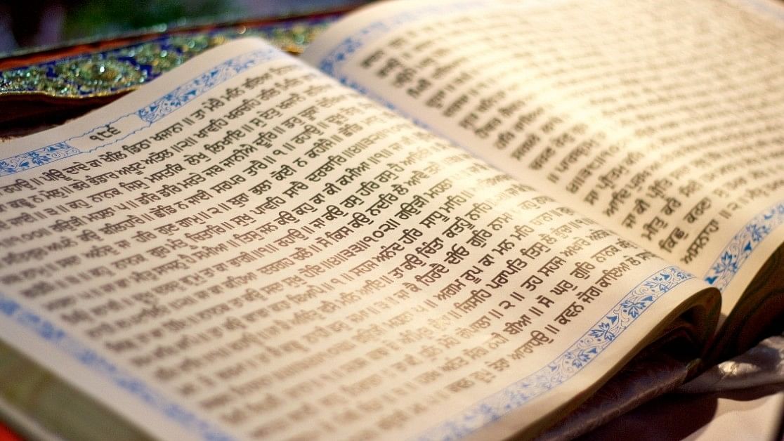 <div class="paragraphs"><p>A page from the Guru Granth Sahib Sikh scripture.(Representative image)</p></div>