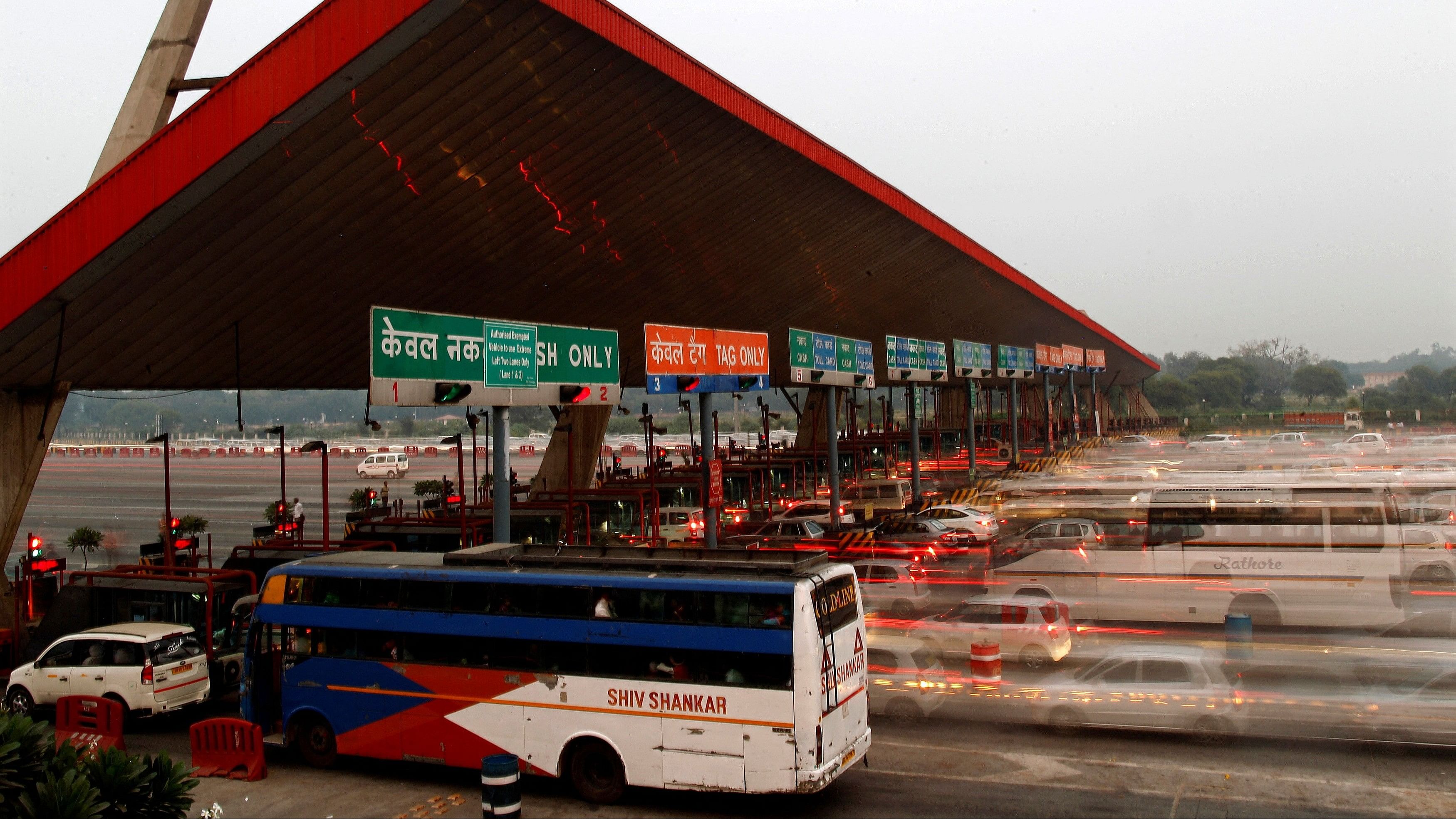 <div class="paragraphs"><p>Vehicles pass through a toll plaza.</p></div>