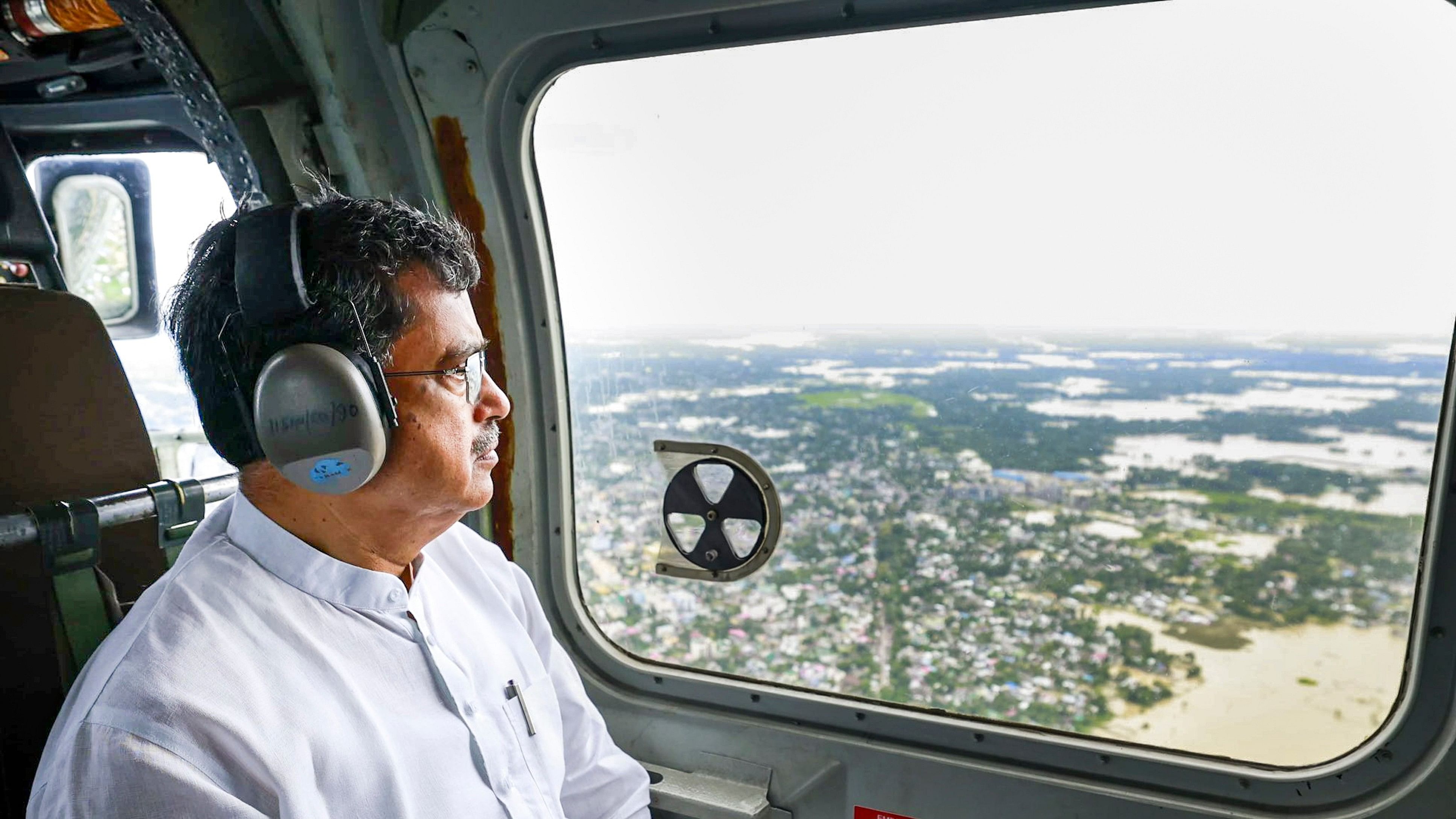 <div class="paragraphs"><p> Tripura Chief Minister Manik Saha takes stock of the flood situation in Tripura from a chopper.</p></div>