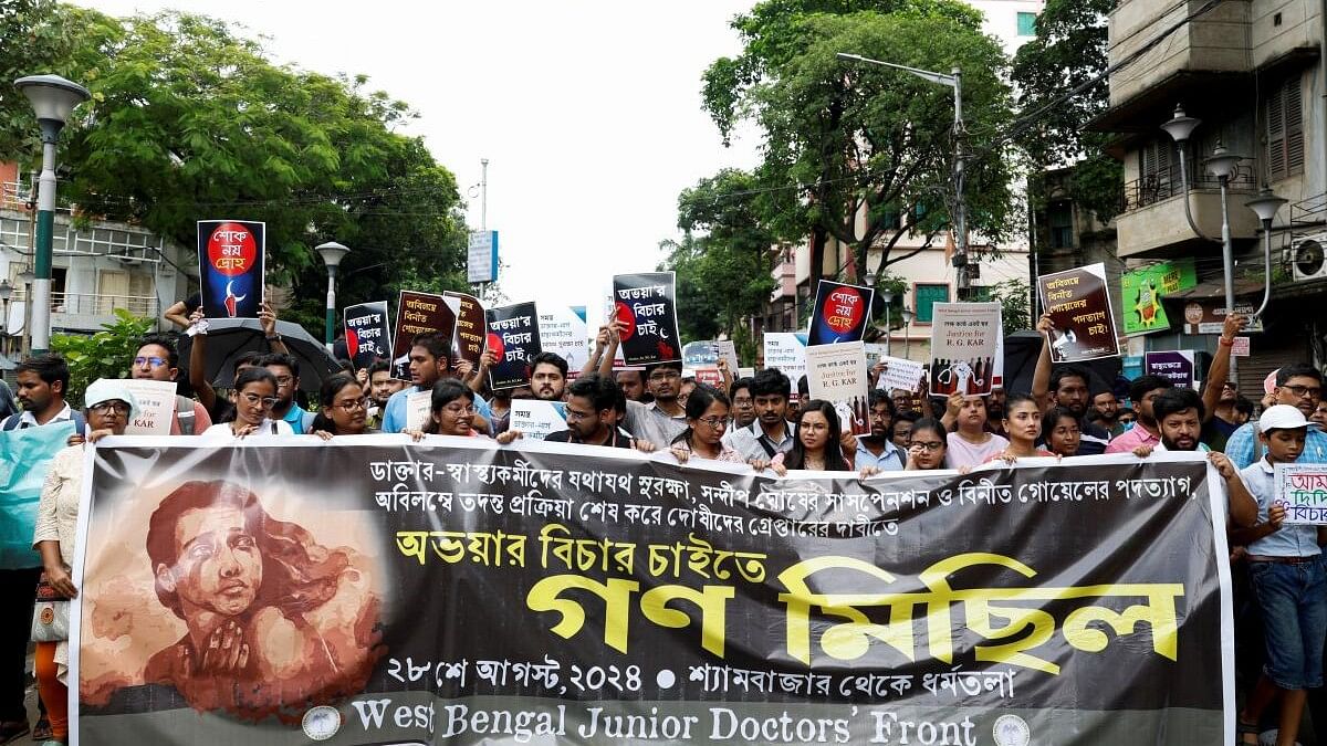 <div class="paragraphs"><p>Members of the West Bengal Junior Doctors' Front march along a street during a protest condemning the rape and murder of a trainee medic at a government-run hospital, in Kolkata.</p></div>