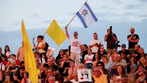 <div class="paragraphs"><p>Family members and supporters of hostages who were kidnapped during the deadly October 7 attack, take part in a ceremony in an effort to bring back the hostages, outside Kibbutz Beeri, southern Israel.</p></div>