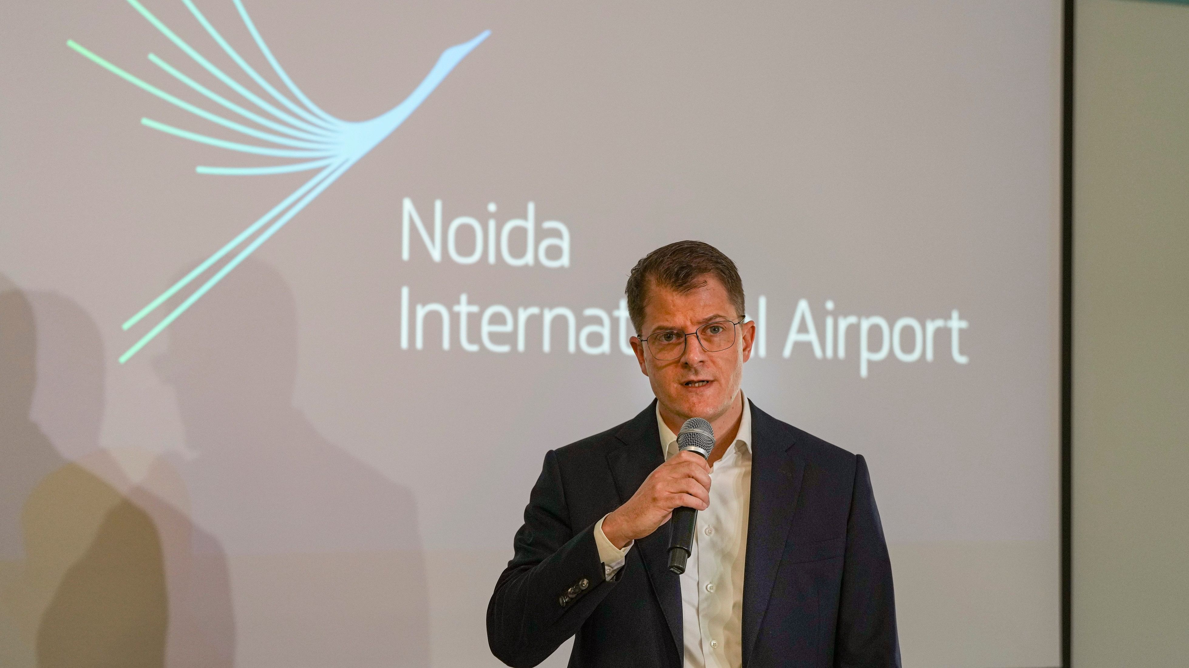 <div class="paragraphs"><p>Noida International Airport CEO Christoph Schnellmann interacts with the media during a presentation, in Noida, Thursday, August 29, 2024.</p></div>