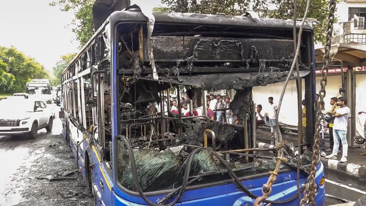 <div class="paragraphs"><p>Charred remains of a low-floor cluster bus is seen after it caught fire at Jagatpuri area in Delhi.&nbsp;</p></div>