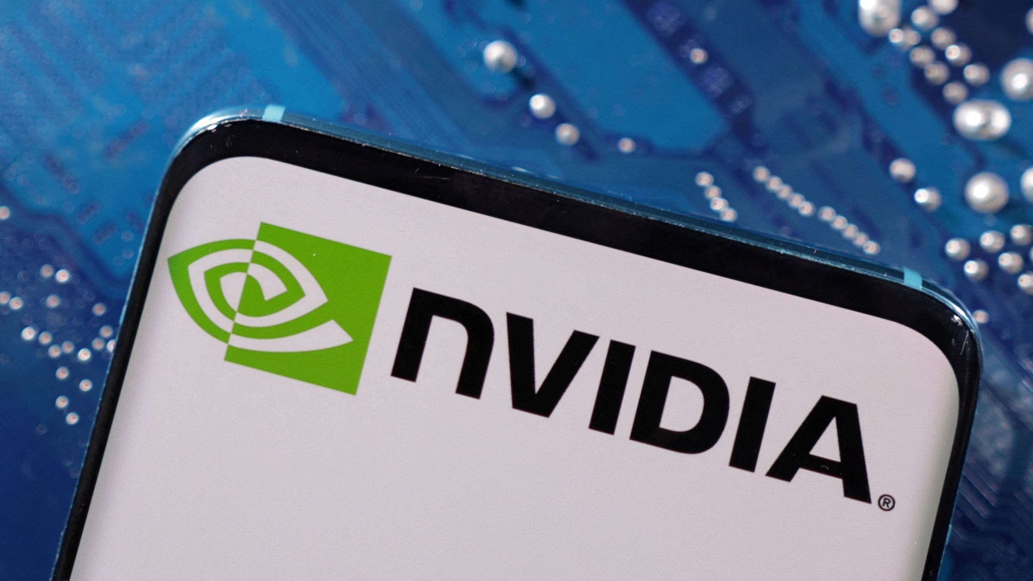 <div class="paragraphs"><p>A smartphone with a displayed NVIDIA logo is placed on a computer motherboard in this illustration.</p></div>