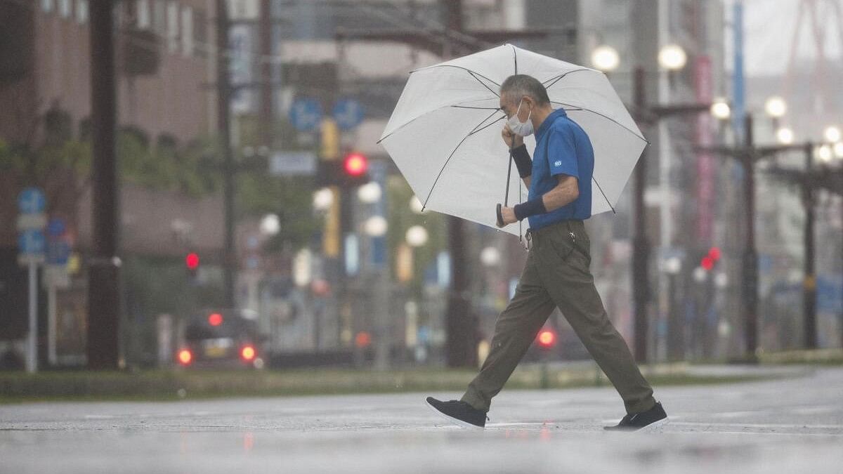 <div class="paragraphs"><p>A passerby holding an umbrella, walks in heavy rains caused by Typhoon Shanshan in Kagoshima, southwestern Japan August 29, 2024.</p></div>