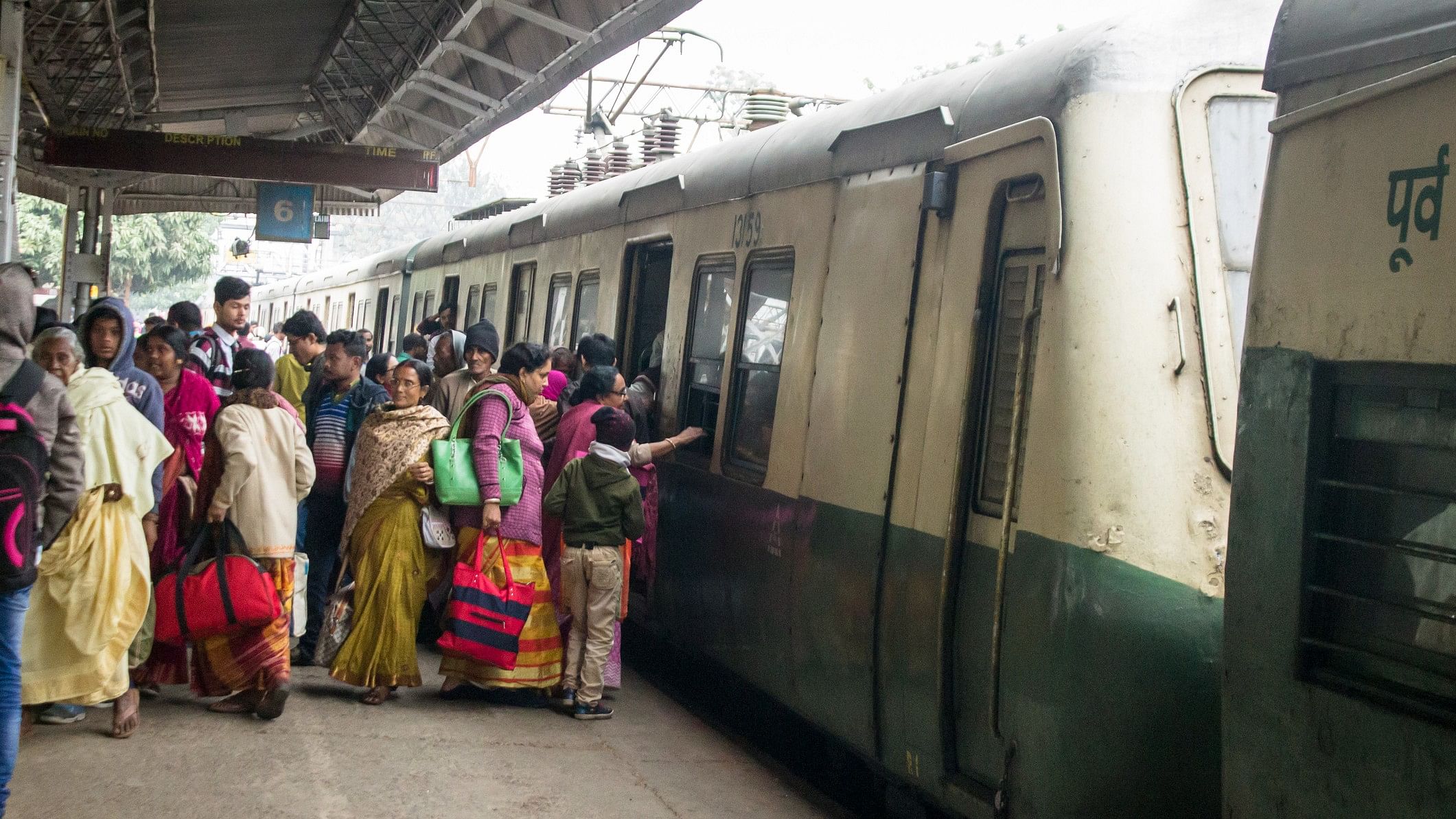 <div class="paragraphs"><p>Representative image showing people boarding a local train in India</p></div>