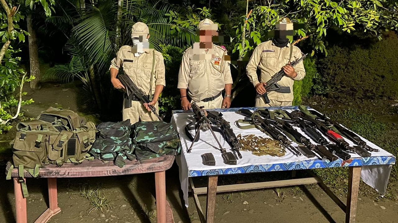 <div class="paragraphs"><p>Manipur Police officials with the seized weapons and ammunition.</p></div>